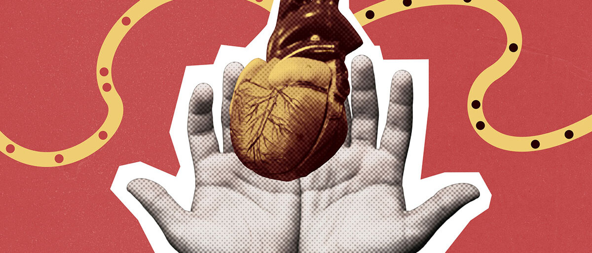 Papercut-Darstellung: Mann hält Herz in Händen