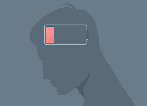 Warnzeichen einer sozialen Erschöpfung erkennen und gegensteuern. Männliche Silhouette mit einer entladenen Energie im Kopf